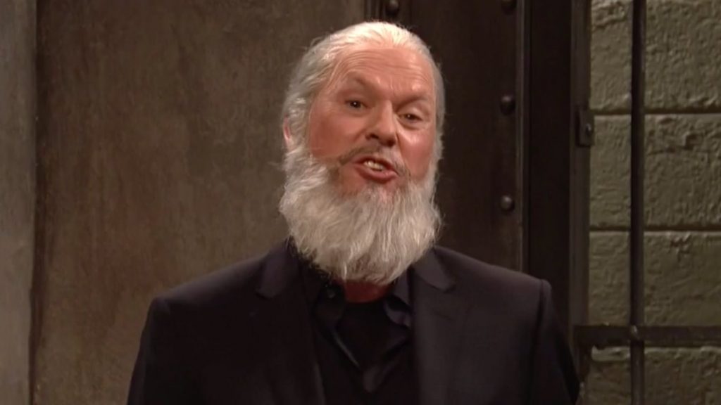 Michael Keaton’s ‘Crazy’ Julian Assange Squares Off Against Michael Avenatti on SNL