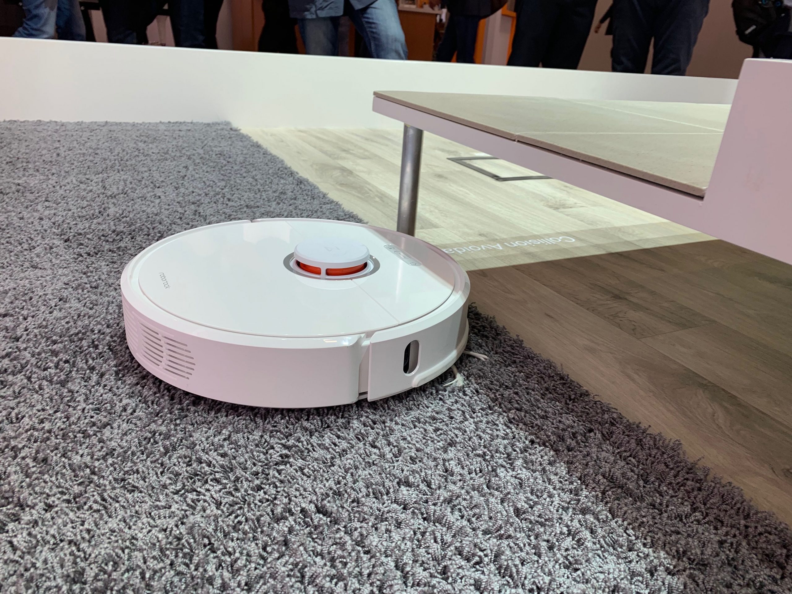 image of the roborock s6 our pick for the best robot vacuum 2021 cleaning under a table