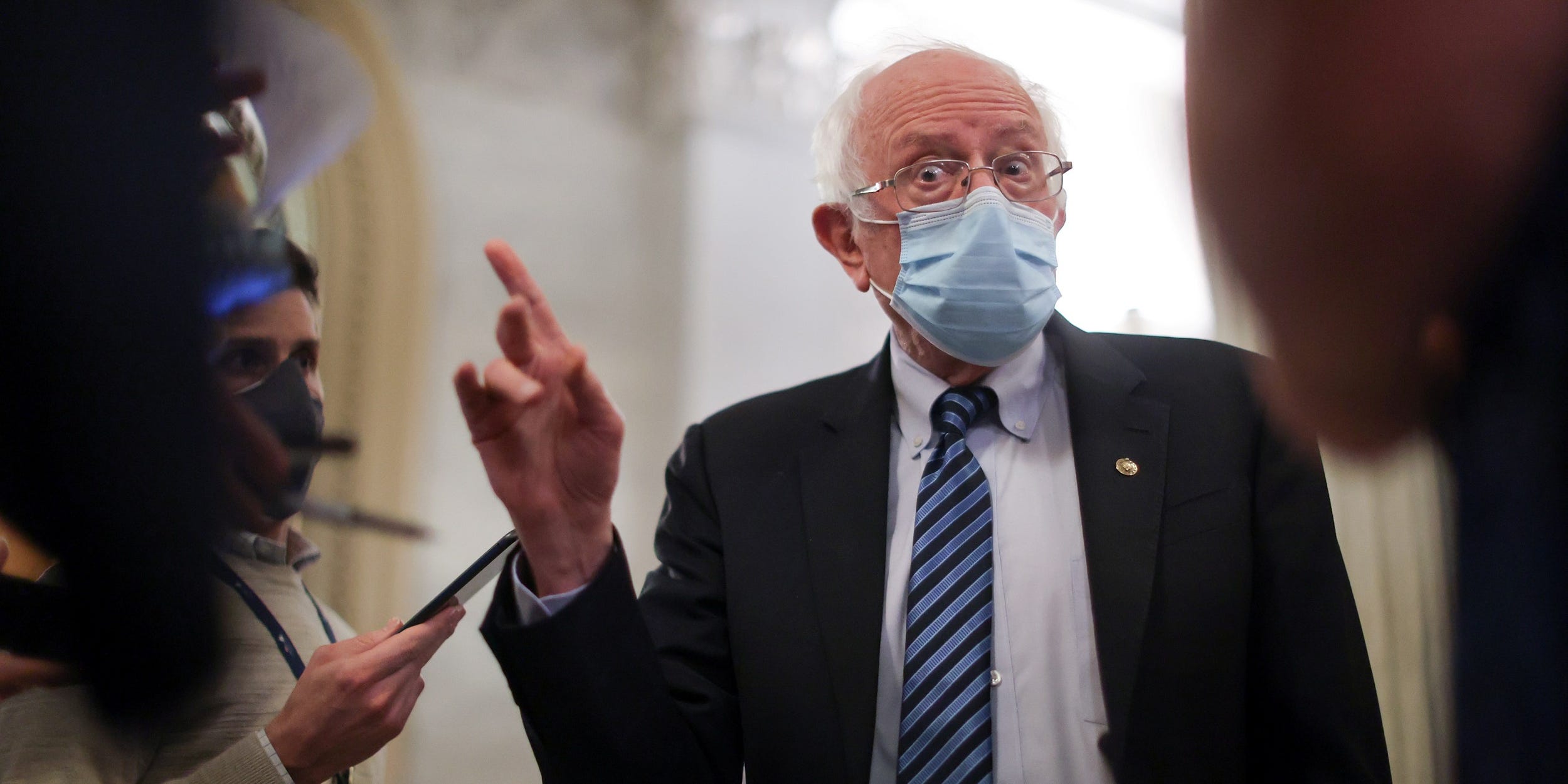 US Senator Bernie Sanders, of Vermont, speaks with reporters about potential efforts to raise the minimum wage at the US Capitol in Washington.
