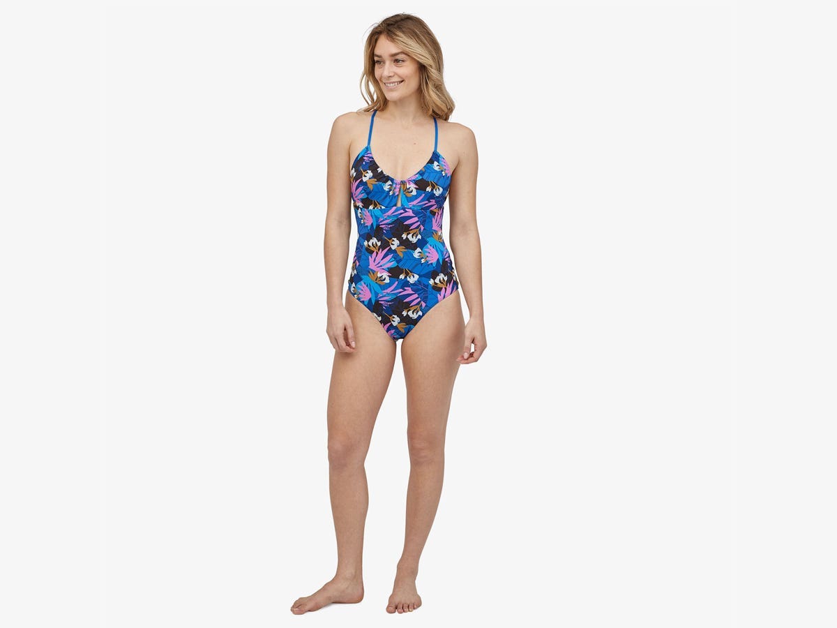 Feminine person wearing a floral one-piece swimsuit from Patagonia
