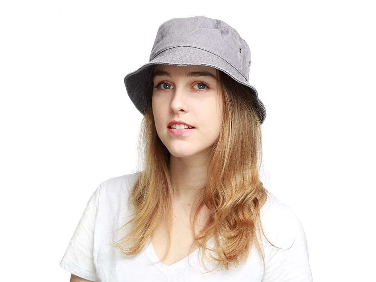 Feminine person wearing gray bucket hat from Hat Depot on Amazon