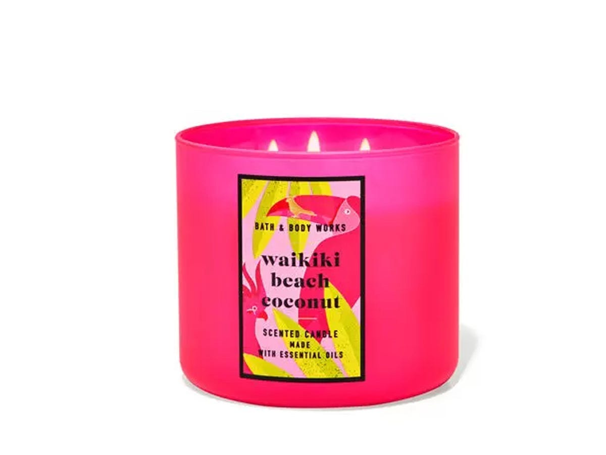 A three-wick, bright pink candle with Waikiki Beach Coconut scent, from Bath & Body Works