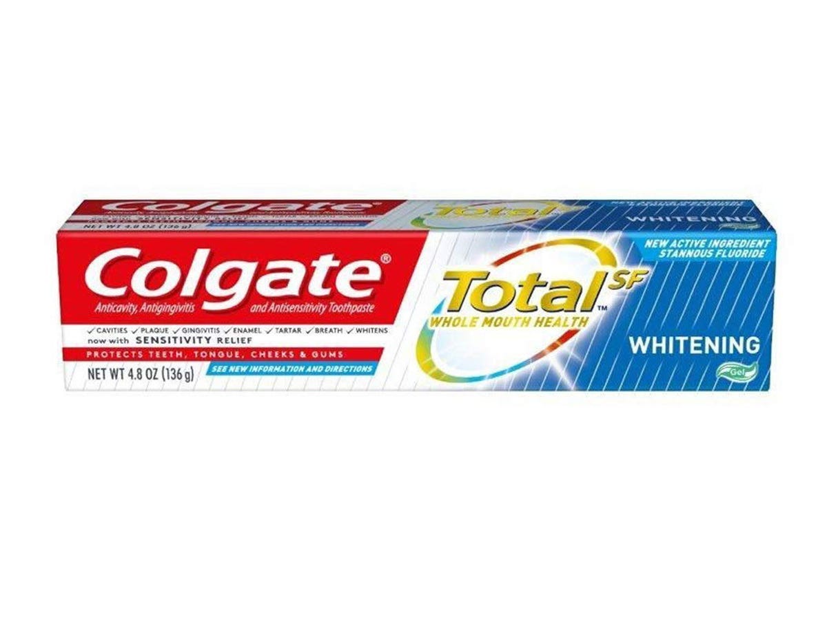 A box of Colgate Total SF Whitening Toothpaste on a white background