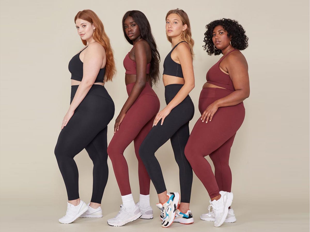 Girlfriend Collective - femme people standing in a row in workout gear